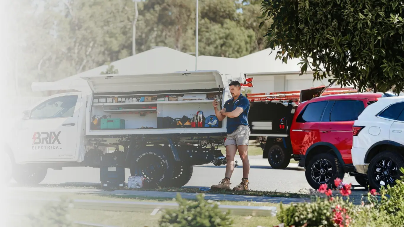 image of brodie leaning over Brix Electrical Truck